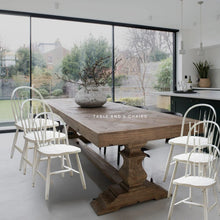 Load image into Gallery viewer, LARGE SALVAGED BLEACHED PINE DINING TABLE WITH SIX ANTIQUED WHITE TRADITIONAL CHAIRS
