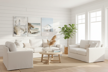 Load image into Gallery viewer, Three beach-themed paintings featuring a lighthouse, a boat, and a house on stilts.