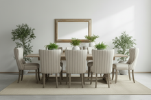 Load image into Gallery viewer, Country Dining table with wooden table and upholstered chairs, framed mirror on the wall, and potted plants.
