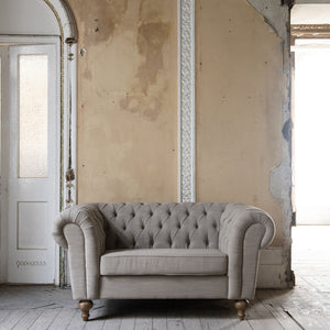Two seater button back linen sofa