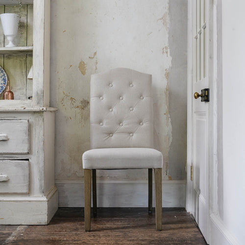 Cream button back dining chair