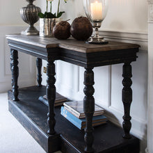 Load image into Gallery viewer, Stunning bleached oak topped console table. The detailing on this console makes it a firm favourite with the One World team. Not only does the unusual shape make it striking but add to that the distressed black finish and the textures wooden top and you have a real conversation piece. Just add lamps, a couple of beautiful mirrors and you are done.
