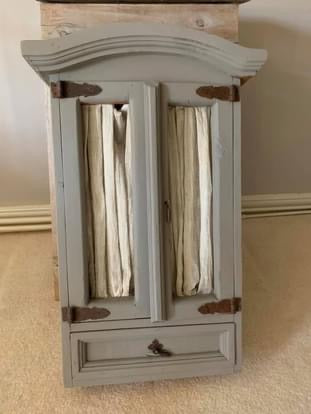 Mango wood wall cupboard painted in french grey with voile.  Ideal in a bathroom or kitchen or small space.  Collection from SY13 2LQ