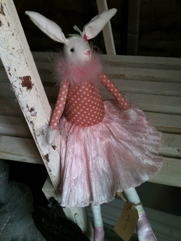 Cute rabbit toy in pink dress with silk shoes