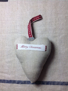 Linen hanging Christmas decoration heart with Merry Christmas on the front.