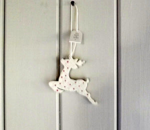 Leaping reindeer wooden cream spotty