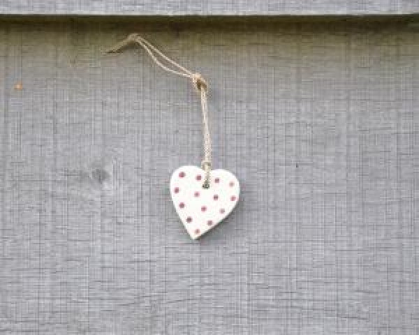 small cream wooden heart on string