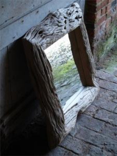  This handmade mirror is made in the Philippians out of old timber from mango trees.